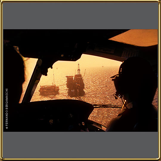 Helicopter over offshore oil rig