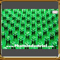 Photo of several green PET bottles.